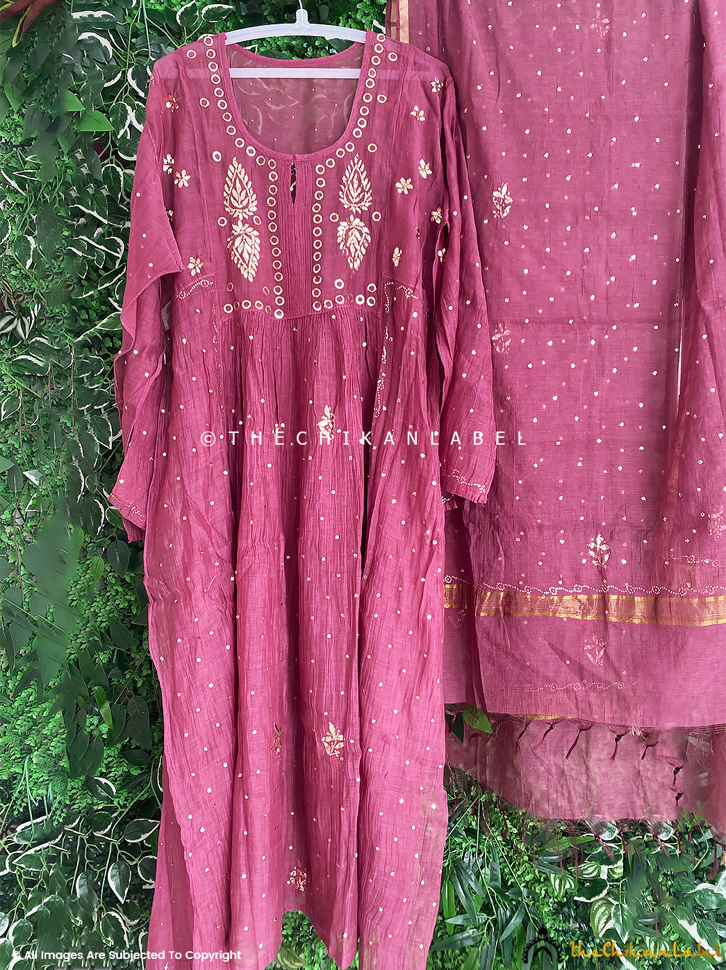 Designer chikankari Anarkali kurti material in breathable chanderi fabric arranged with dupatta for luxury ethnic presentation

