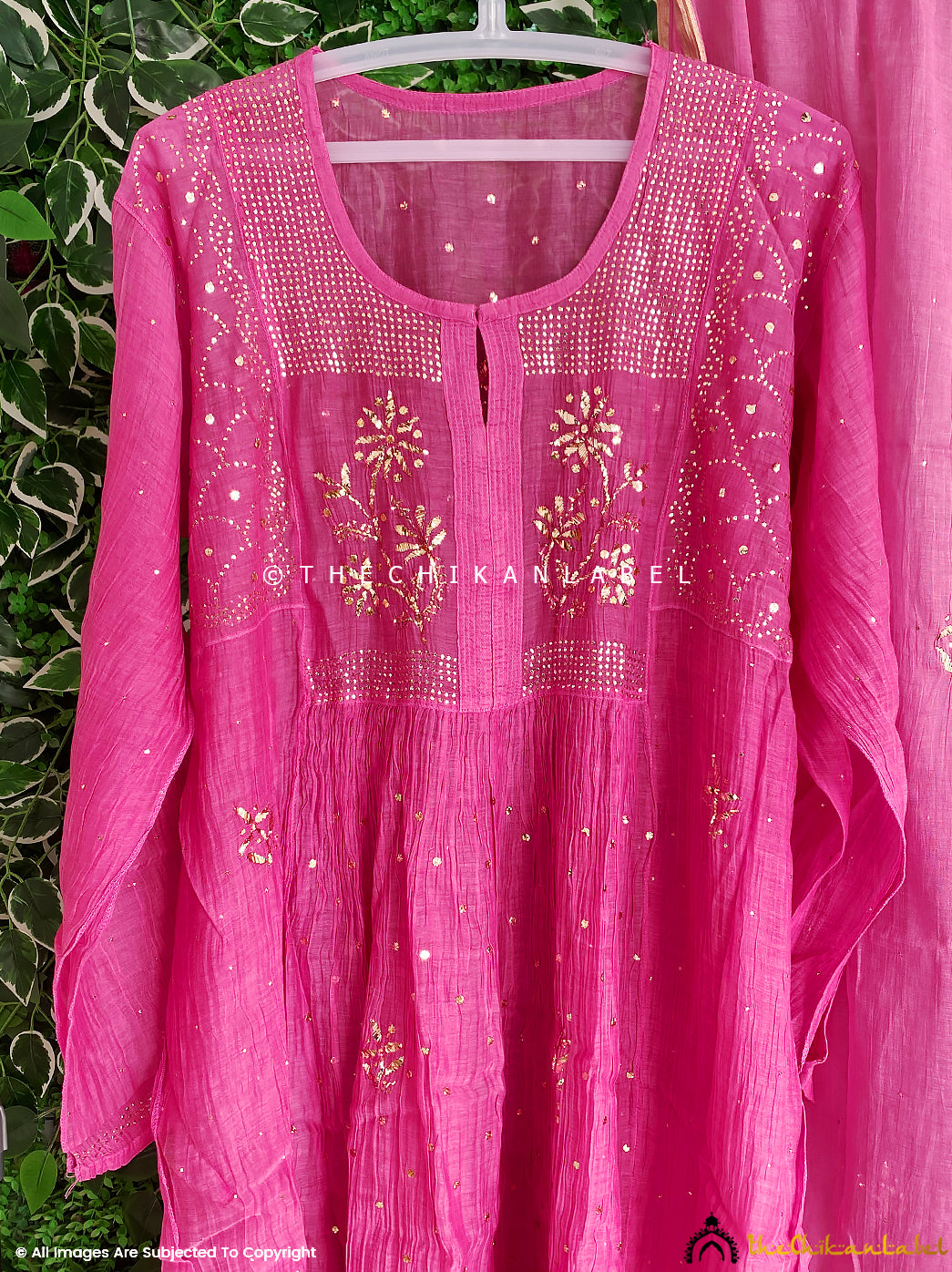 Flat lay of semi-stitched Anarkali kurti piece and dupatta designed for tailoring into luxury ethnic wear with floral chikankari work

