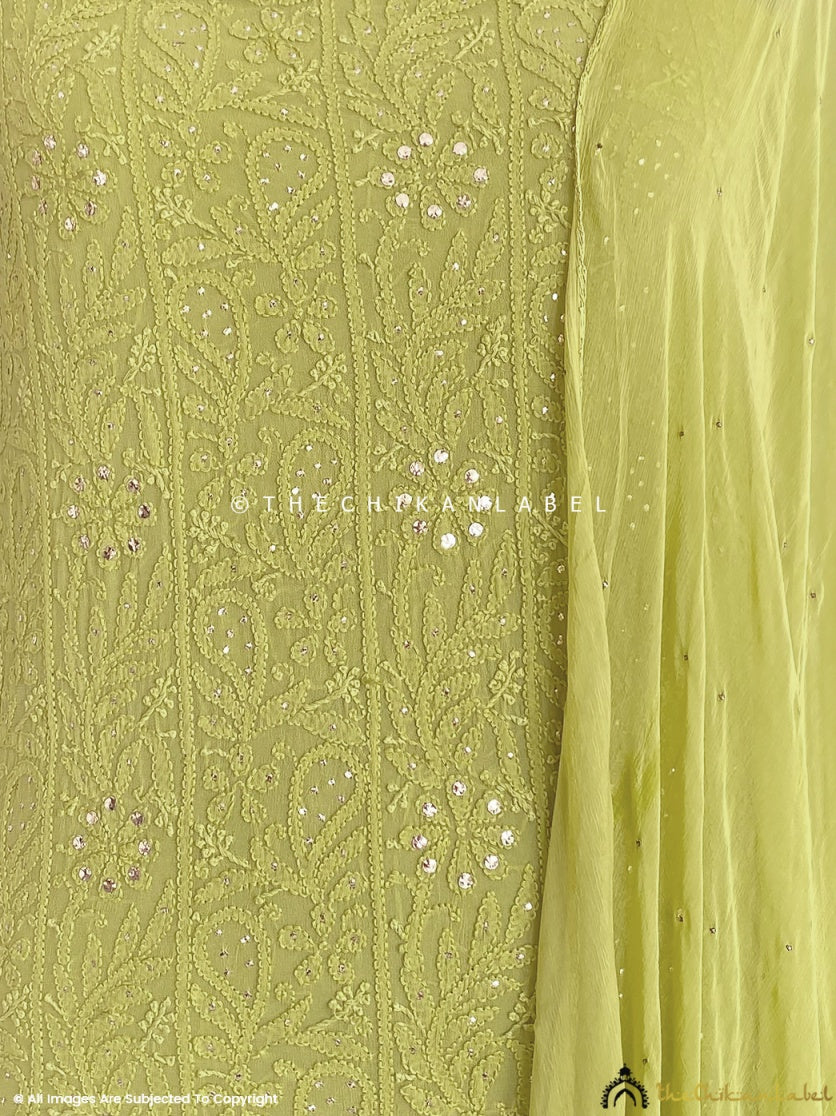 “Close-up of delicate chikankari hand embroidery with mirror embellishments on viscose kurti piece with dupatta”