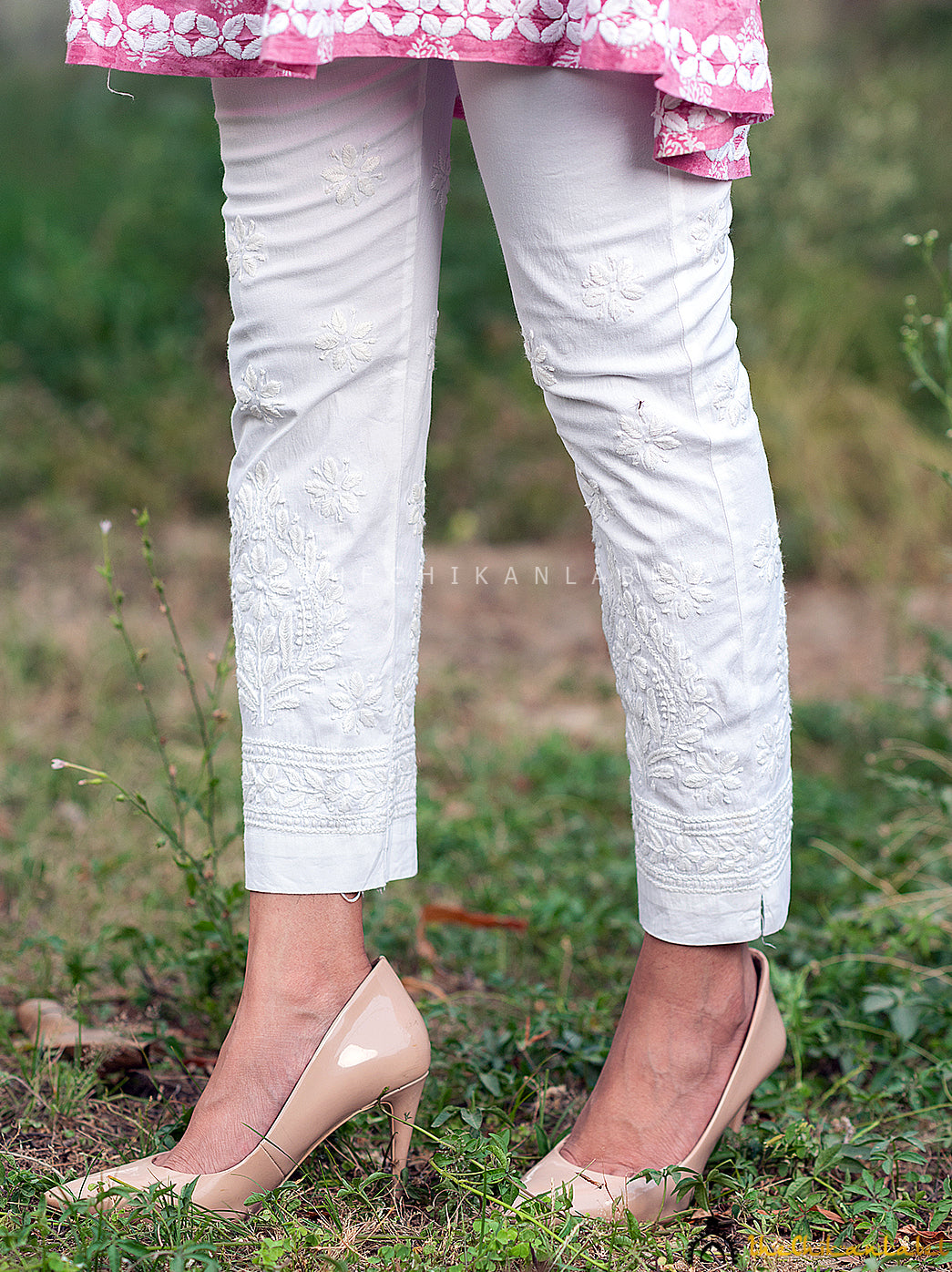 White Adya Lycra Straight Chikankari Cigarette Pant, Shop now from a collection of chikankari cigarette pants at Thechikanlabel, Buy lucknow chikankari straight cigarette pants online at best price.2