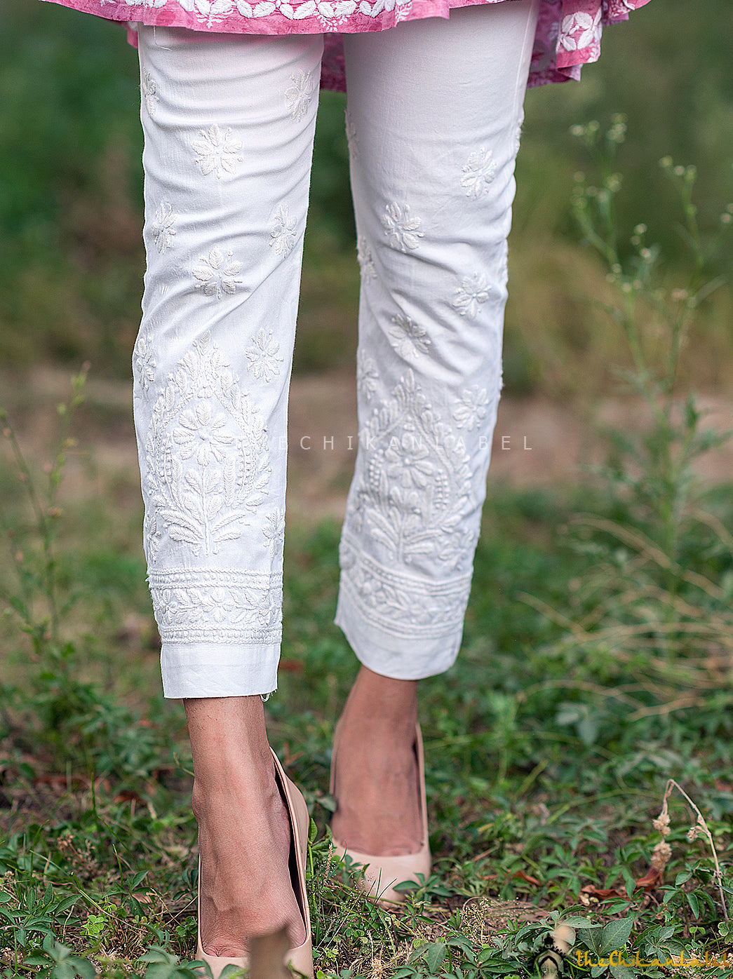 White Adya Lycra Straight Chikankari Cigarette Pant, Shop now from a collection of chikankari cigarette pants at Thechikanlabel, Buy lucknow chikankari straight cigarette pants online at best price.3