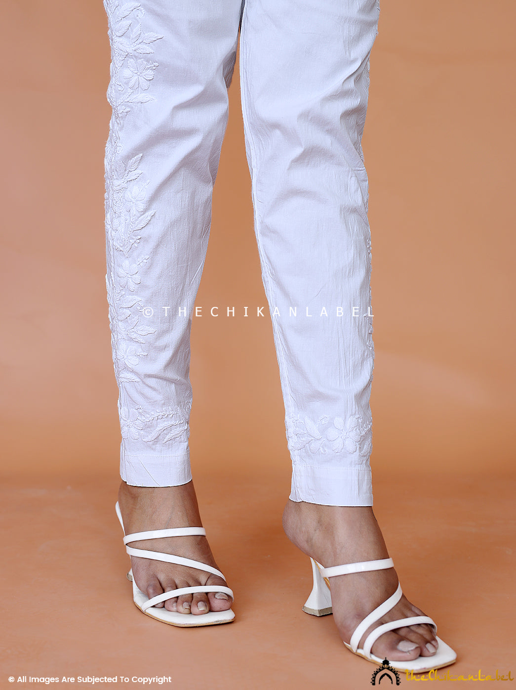 White Aqsa Side Work Chikankari Pant, Shop now from a collection of chikankari cigarette pants at Thechikanlabel, Buy lucknow chikankari straight cigarette pants online at best price.